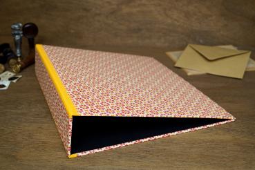 Yellow folder with orange flowers